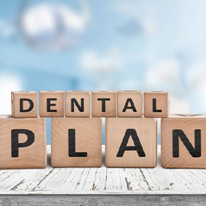 Blocks spell “dental plan”
