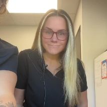 Blonde dental team member with glasses
