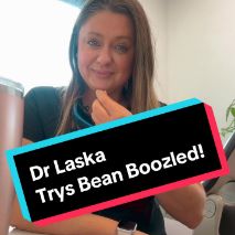 Woman with glasses rubbing chin with message Dr. Laska Trys Bean Boozled
