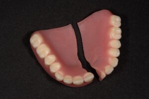 A denture that is broken in half