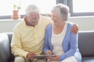 Senior couple using tablet to review their Medicare benefits