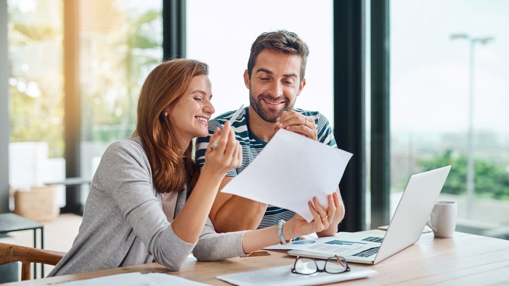 A couple calculating their family budget